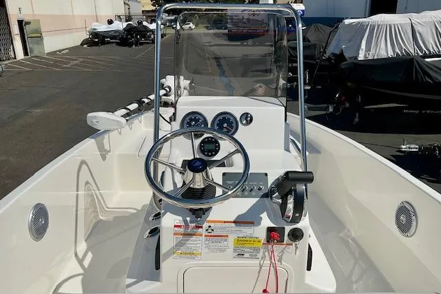 Slide: The Image of 2026 Bayliner Trophy T18 boat dashboard with steering wheel and gauges. - 17