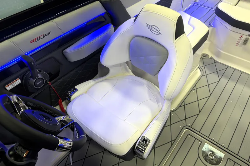 Slide: The Image of 2026 Chaparral GTS 6 boat interior with white seating and blue LED lighting. - 12