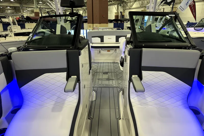 Slide: The Image of 2026 Chaparral GTS 6 boat interior with modern seating and ambient blue lighting. - 21
