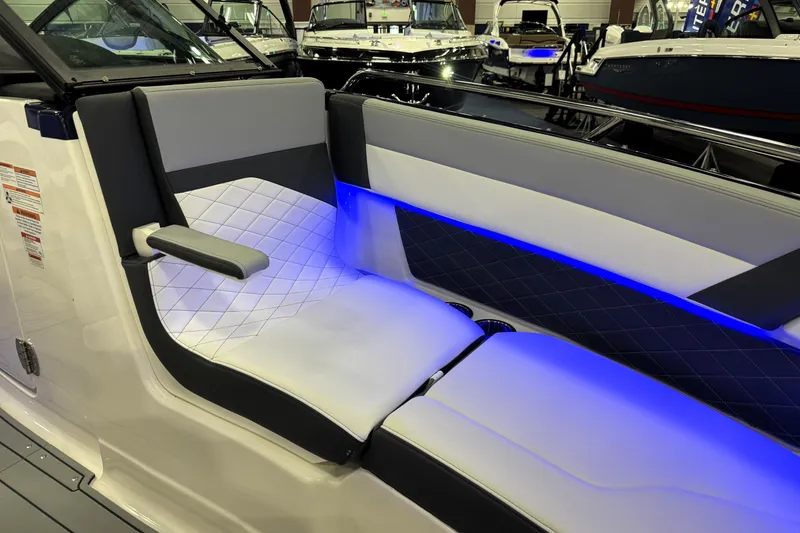 Slide: The Image of 2026 Chaparral GTS 6 boat interior with modern seating and blue LED lighting. - 24