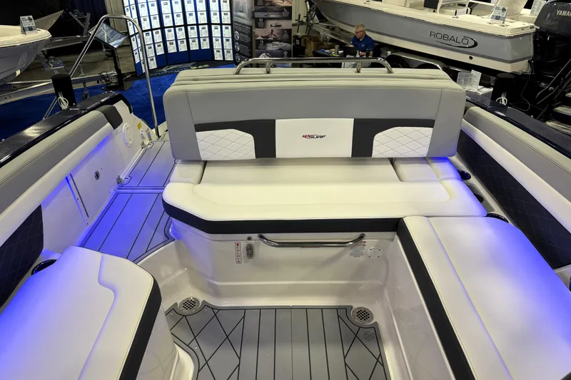 Slide: The Image of 2026 Chaparral GTS 6 boat interior with modern seating and ambient blue lighting. - 30