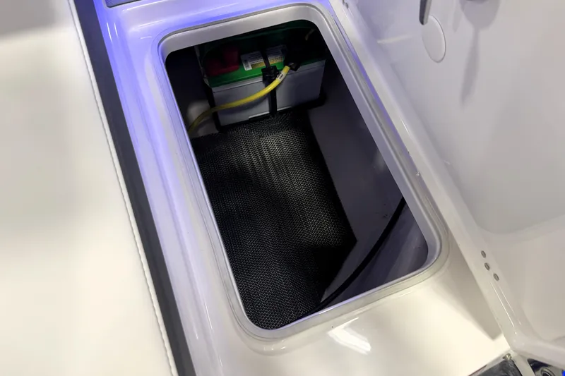 Slide: The Image of 2026 Chaparral GTS 6 boat storage compartment with battery and wiring. - 36