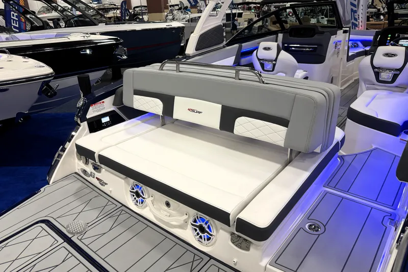 Slide: The Image of 2026 Chaparral GTS 6 boat interior with modern seating and blue LED lighting. - 47