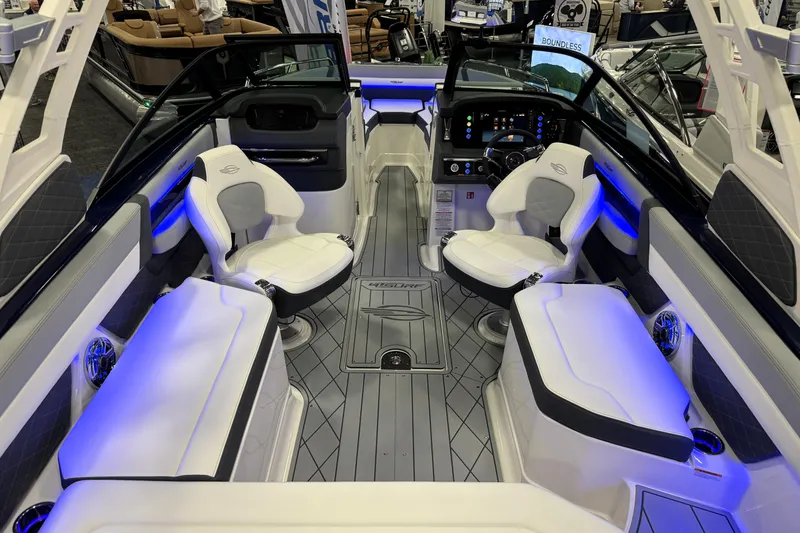 Slide: The Image of 2026 Chaparral GTS 6 boat interior with modern seating and blue LED lighting. - 51