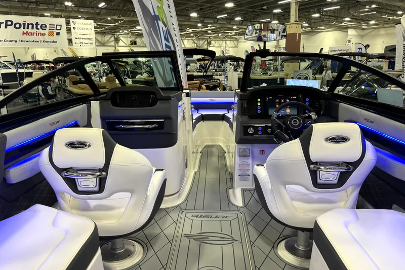 Slide: The Image of 2026 Chaparral GTS 6 boat interior with modern dashboard and seating at a marine exhibition. - 52