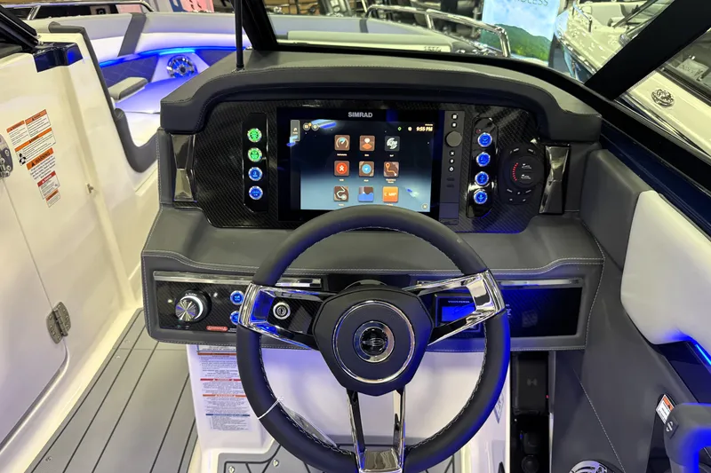 Slide: The Image of 2026 Chaparral GTS 6 boat dashboard with modern steering and digital display. - 53