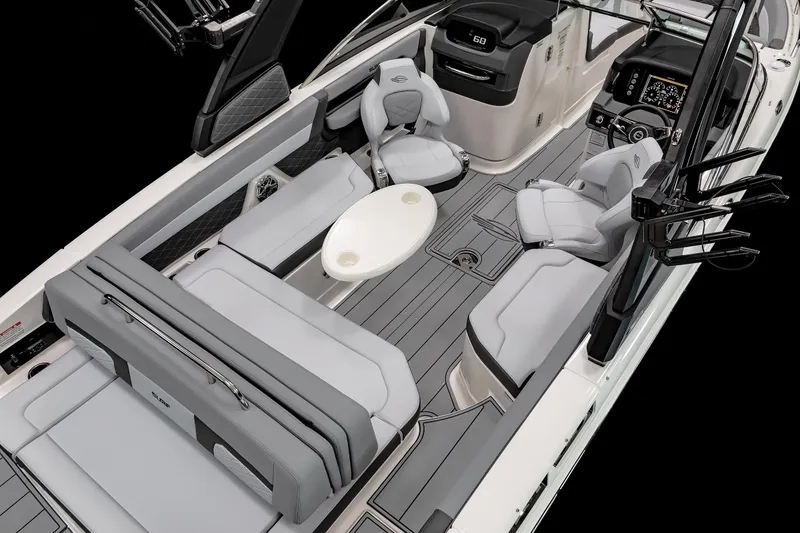 Slide: The Image of 2026 Chaparral GTS 6 boat displayed indoors on a trailer at a boat show. - 9