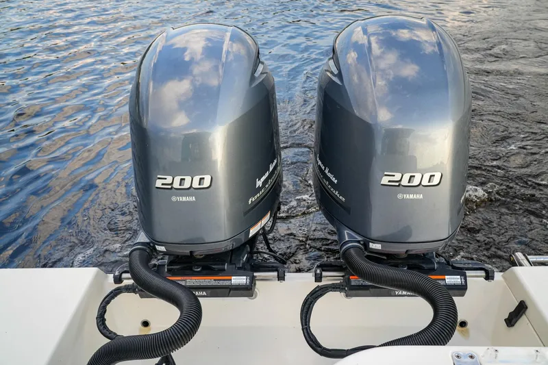 Slide: The Image of Twin Yamaha 200 outboard engines on a 2023 Cobia 262cc boat. - 7