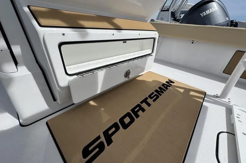 Slide: The Image of 2026 Sportsman Masters 247OE Bay Boat interior with Yamaha engine visible. - 13