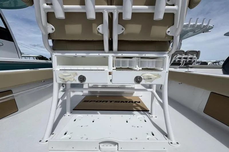 Slide: The Image of 2026 Sportsman Masters 247OE Bay Boat interior with seating and storage compartments. - 18