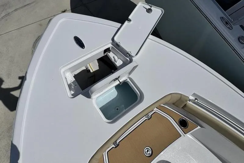 Slide: The Image of 2026 Sportsman Masters 247OE Bay Boat deck with open storage compartment. - 21