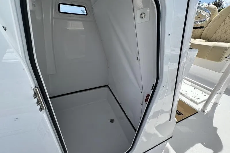 Slide: The Image of Interior view of 2026 Sportsman Masters 247OE Bay Boat cabin space. - 9