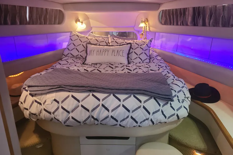 Slide: The Image of Cozy bedroom in 1995 Sea Ray 450 Sundancer yacht with ambient lighting and decorative pillows. - 4