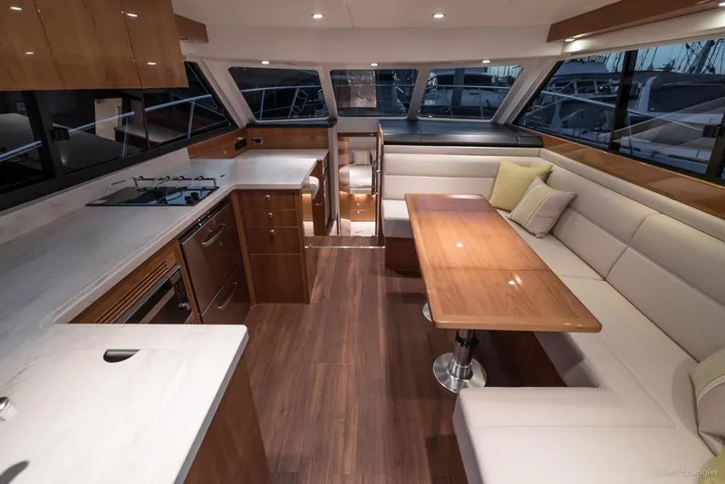 Slide: The Image of Outdoor kitchen on 2017 Riviera 43 Flybridge yacht with city skyline view. - 10