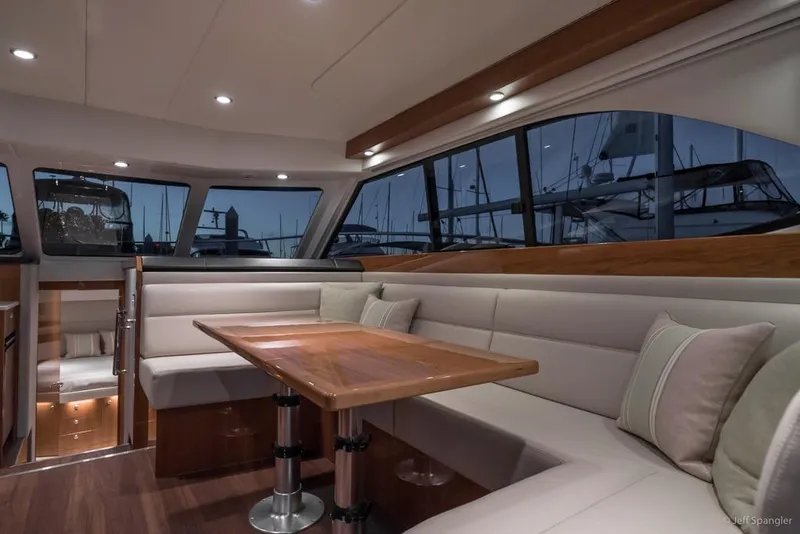 Slide: The Image of 2017 Riviera 43 Flybridge yacht controls with water view in the background. - 11