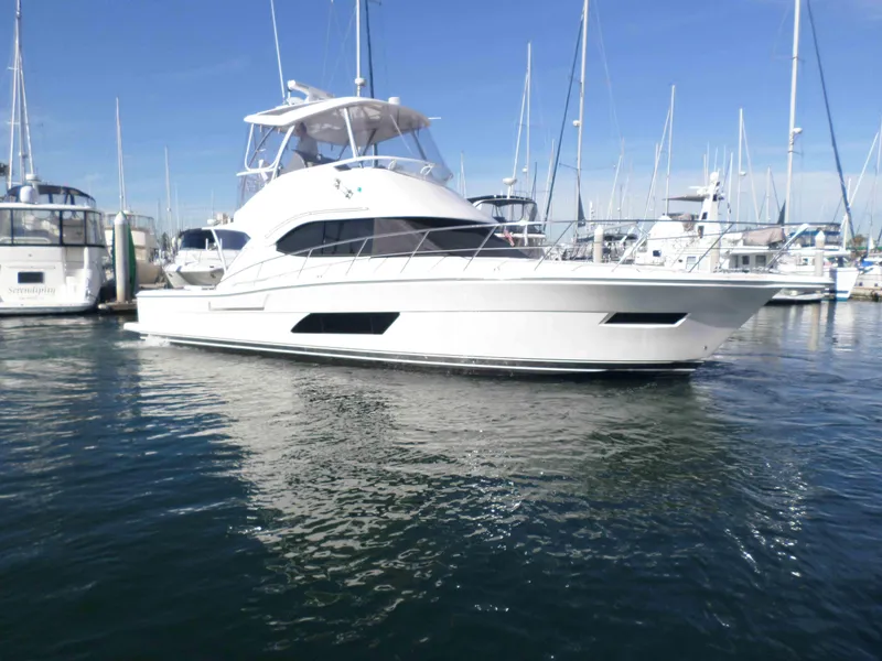 Slide: The Image of 2017 Riviera 43 Flybridge yacht cruising on calm waters. - 2