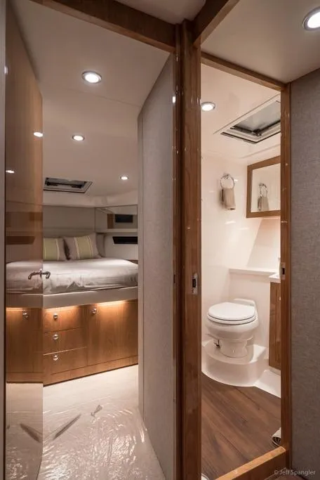 Slide: The Image of Storage drawers on the 2017 Riviera 43 Flybridge yacht, featuring sleek white design. - 21