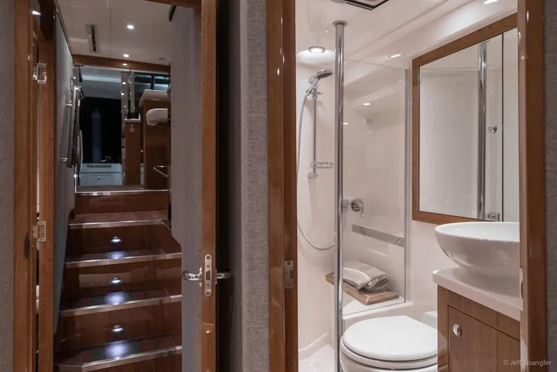 Slide: The Image of Luxurious interior of 2017 Riviera 43 Flybridge yacht with modern kitchen and seating area. - 23