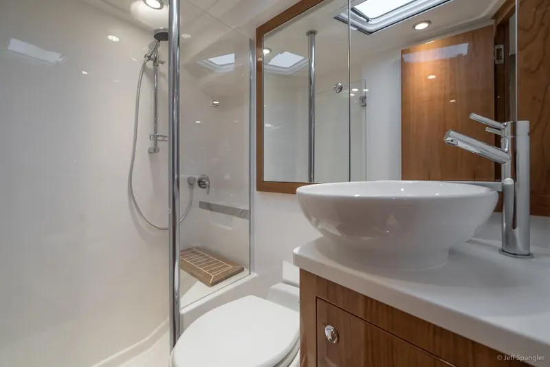 Slide: The Image of Luxurious interior of 2017 Riviera 43 Flybridge yacht with elegant seating and panoramic windows. - 24