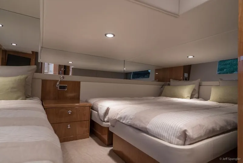 Slide: The Image of Luxurious 2017 Riviera 43 Flybridge yacht kitchen with modern appliances and waterfront view. - 26