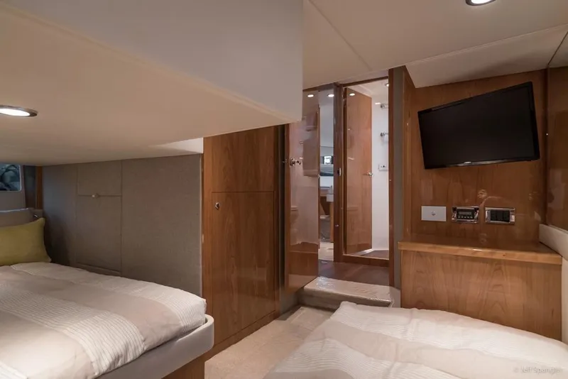 Slide: The Image of Luxurious 2017 Riviera 43 Flybridge yacht kitchen with modern appliances and waterfront view. - 29