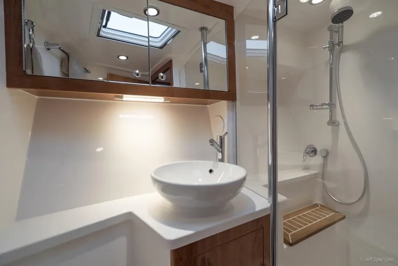 Slide: The Image of Luxurious interior of 2017 Riviera 43 Flybridge yacht with elegant seating and panoramic windows. - 33