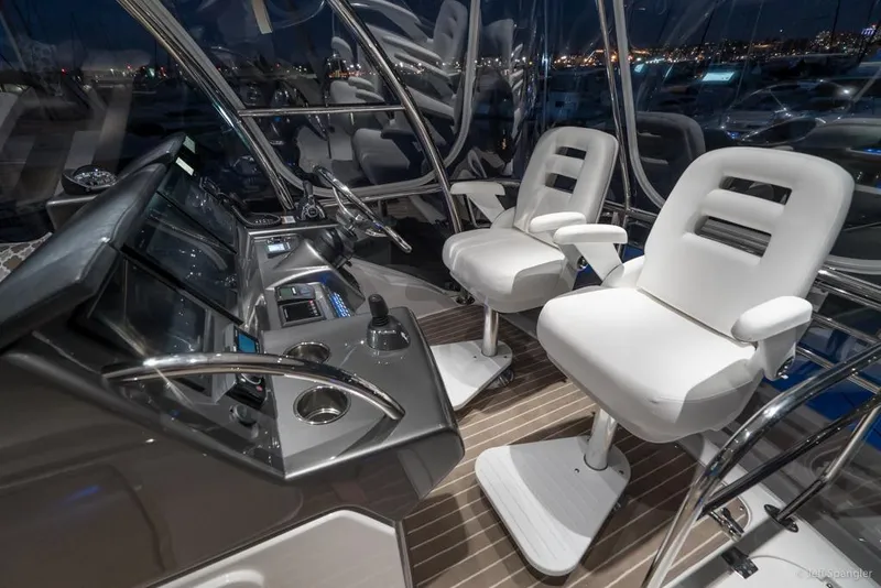 Slide: The Image of Luxurious interior of 2017 Riviera 43 Flybridge yacht with wood finish and scenic water view. - 34