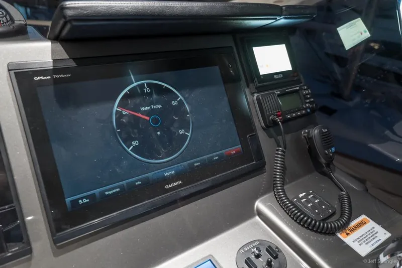 Slide: The Image of Luxurious interior of 2017 Riviera 43 Flybridge yacht with modern wood finish and seating. - 35