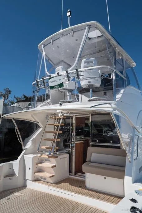 Slide: The Image of 2017 Riviera 43 Flybridge yacht with spacious deck and elegant interior on calm waters. - 7