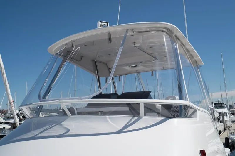 Slide: The Image of Riviera 43 Flybridge 2017 yacht deck with cityscape and waterfront view. - 8