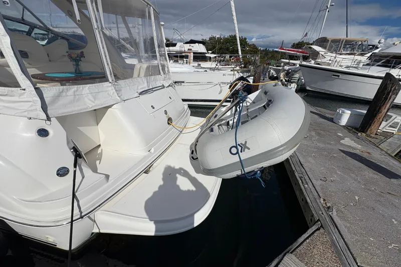 Slide: The Image of 2003 Sea Ray 360 Sundancer docked with inflatable dinghy attached. - 13