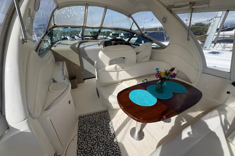 Slide: The Image of Luxurious 2003 Sea Ray 360 Sundancer yacht interior with elegant seating and dining area. - 15