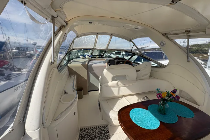 Slide: The Image of Interior of 2003 Sea Ray 360 Sundancer yacht with elegant seating and table setting. - 16