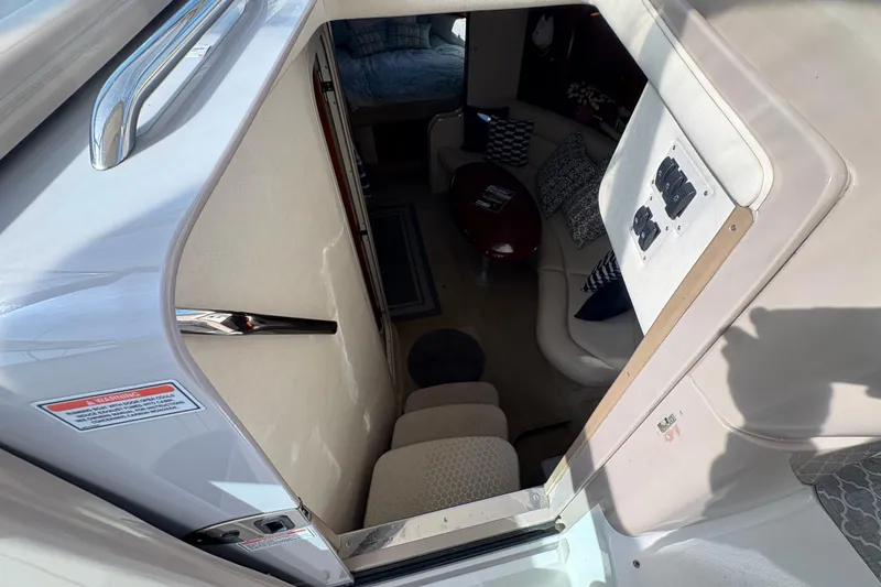 Slide: The Image of Interior view of 2003 Sea Ray 360 Sundancer yacht cabin with seating and table. - 22