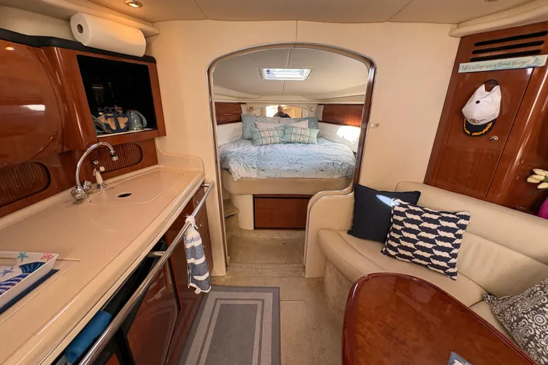 Slide: The Image of Interior of 2003 Sea Ray 360 Sundancer yacht with cozy cabin and kitchenette. - 26