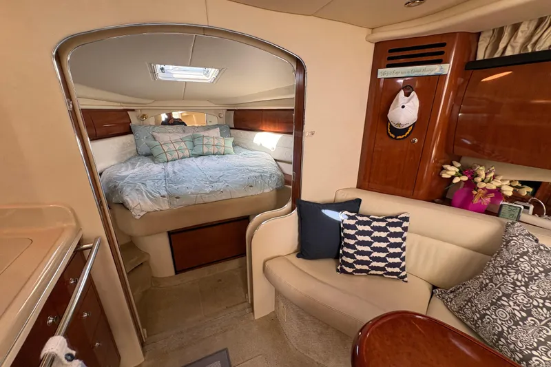 Slide: The Image of Interior of 2003 Sea Ray 360 Sundancer with cozy cabin and elegant decor. - 27