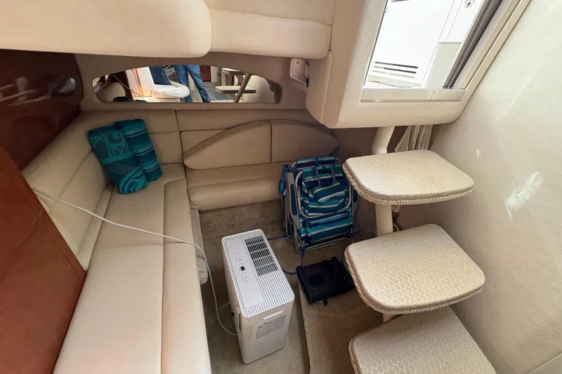 Slide: The Image of Interior of 2003 Sea Ray 360 Sundancer with beige seating and compact stairs. - 32