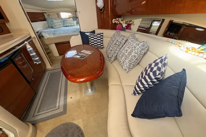 Slide: The Image of Luxurious interior of 2003 Sea Ray 360 Sundancer with plush seating and elegant decor. - 36