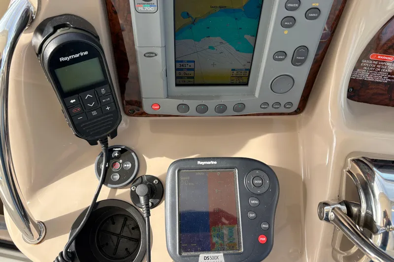 Slide: The Image of Control panel of a 2003 Sea Ray 360 Sundancer with navigation equipment. - 51