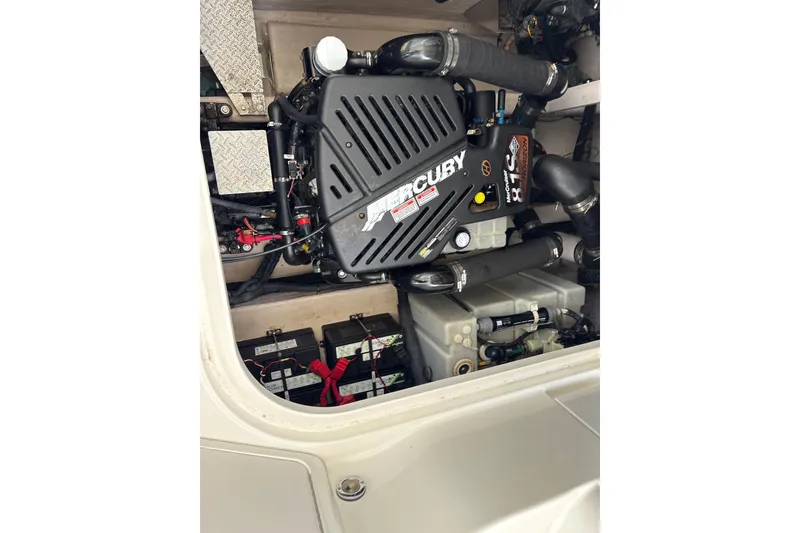 Slide: The Image of Engine compartment of a 2003 Sea Ray 360 Sundancer with Mercury engine components. - 54