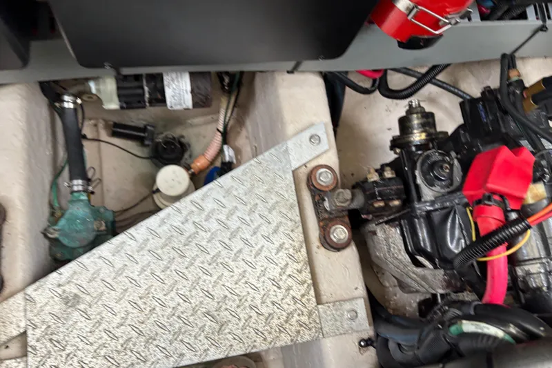 Slide: The Image of Engine compartment of a 2003 Sea Ray 360 Sundancer boat, showing mechanical components. - 58