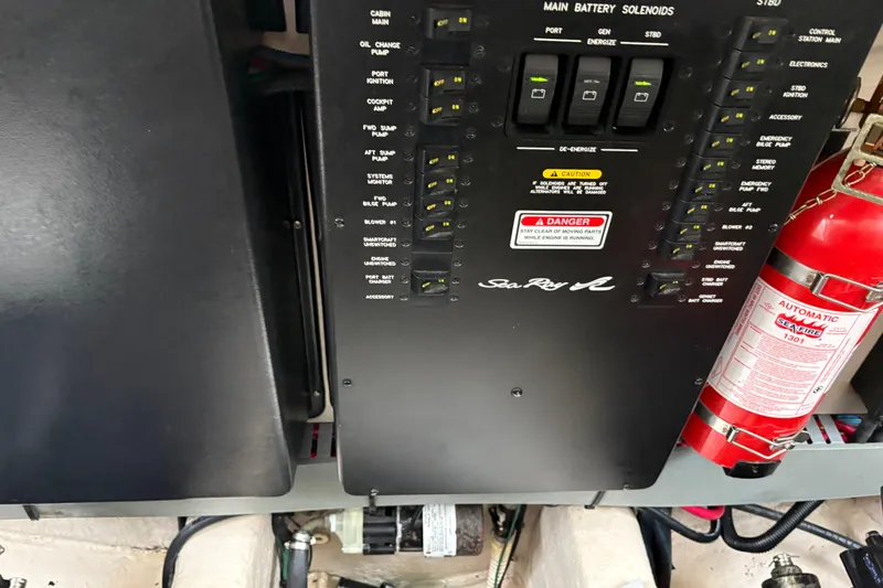 Slide: The Image of Control panel of a 2003 Sea Ray 360 Sundancer with fire extinguisher. - 59