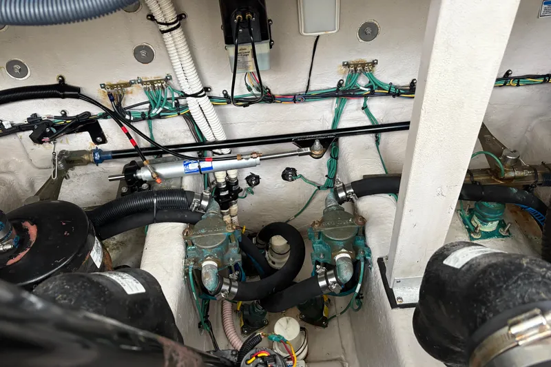 Slide: The Image of Engine compartment of a 2003 Sea Ray 360 Sundancer with visible wiring and components. - 62