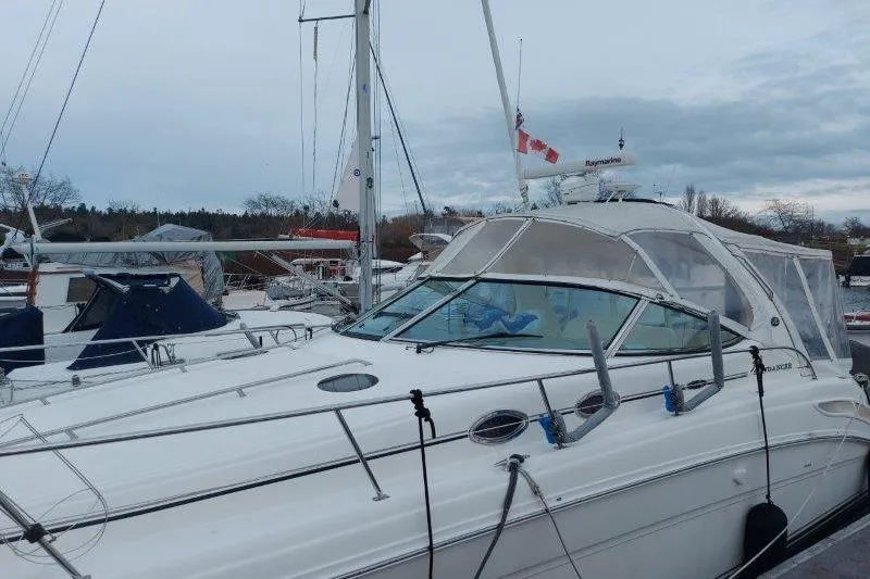 Slide: The Image of 2003 Sea Ray 360 Sundancer yacht docked at marina under cloudy sky. - 9