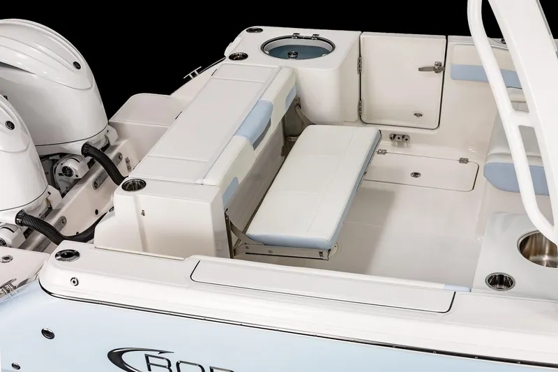 Slide: The Image of 2026 Robalo R257 Dual Console boat interior with seating and storage compartments. - 22