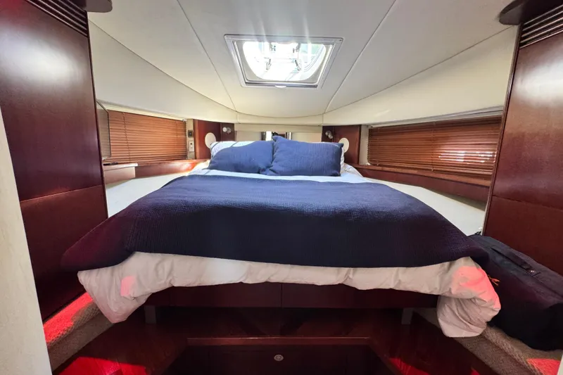 Slide: The Image of Luxurious cabin interior of 2006 Sea Ray 48 Sundancer yacht with cozy bedding. - 15