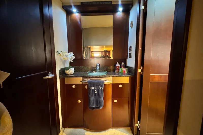 Slide: The Image of Luxurious bathroom interior of 2006 Sea Ray 48 Sundancer yacht with elegant wood cabinetry. - 16