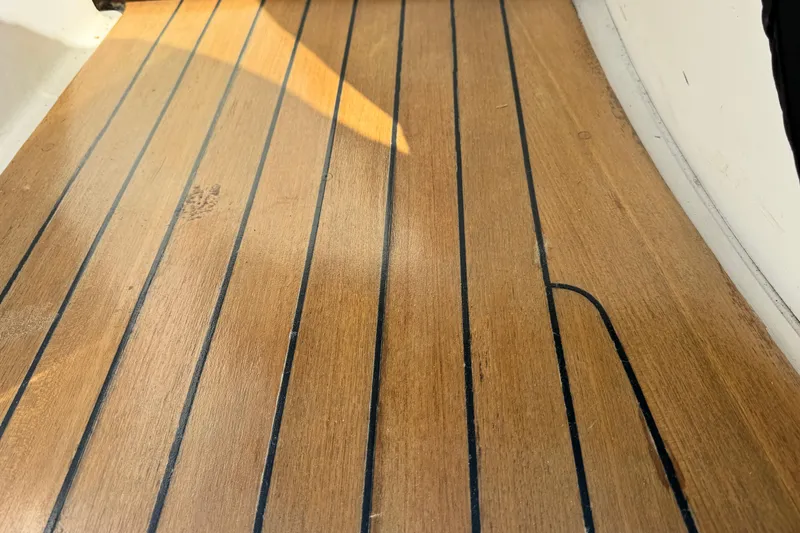 Slide: The Image of Teak deck of 2006 Sea Ray 48 Sundancer yacht, showcasing elegant wood finish. - 32