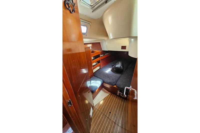 Slide: The Image of Cozy cabin interior of 1996 Beneteau Oceanis 440 sailboat with wooden finishes. - 25