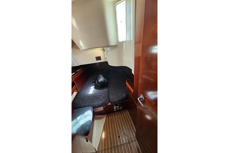 Slide: The Image of Interior cabin of 1996 Beneteau Oceanis 440 sailboat with wooden flooring. - 26